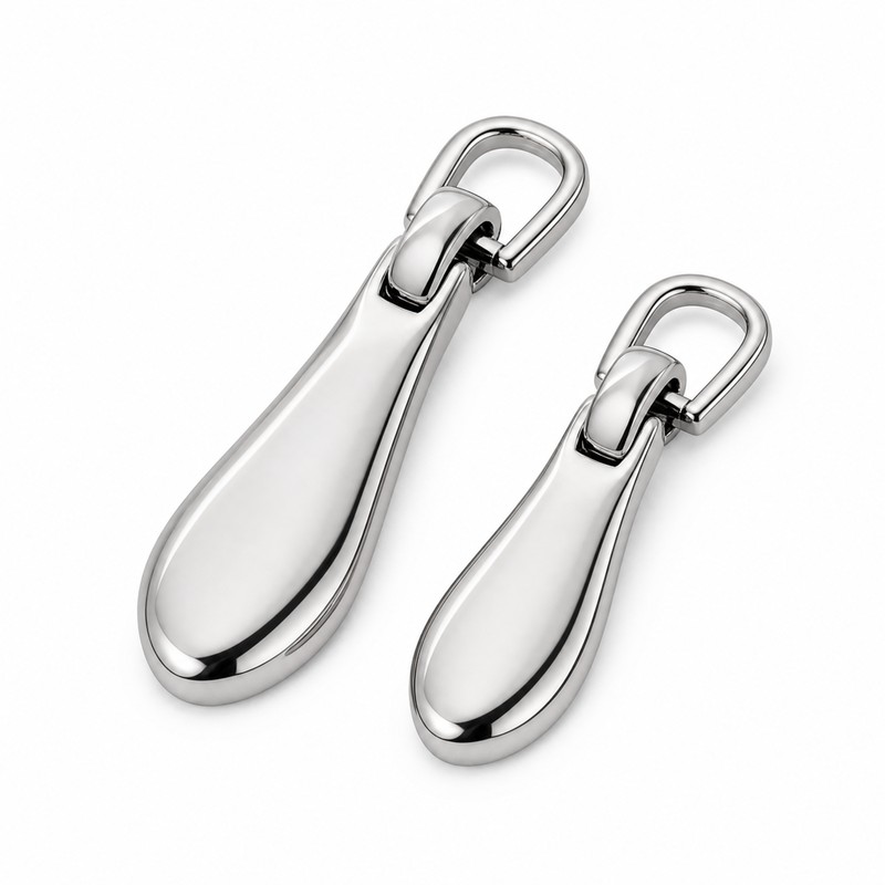 Polished stainless steel zipper pulls for luxury bags and garments