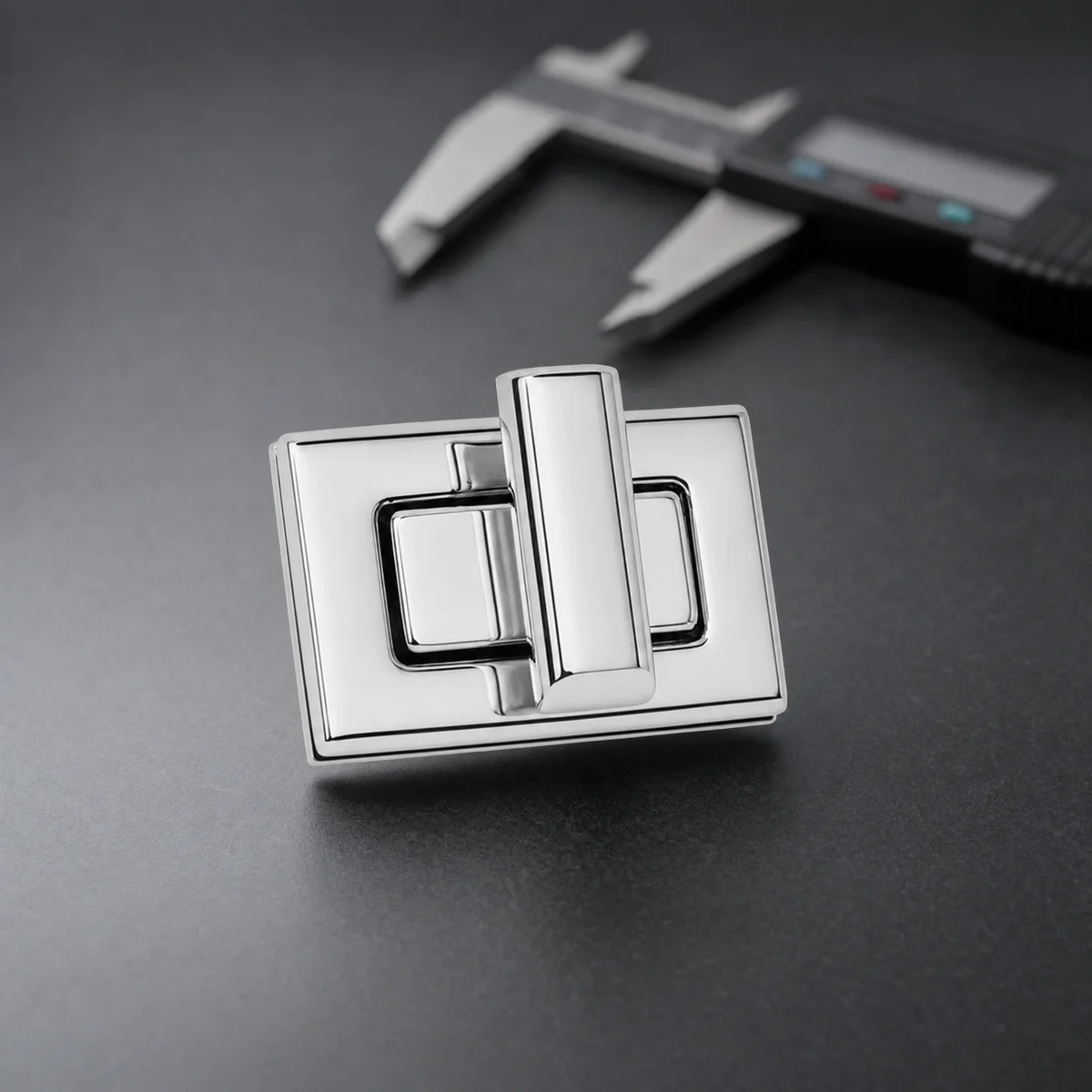 Polished turn lock on inspection mat with precision caliper for quality control